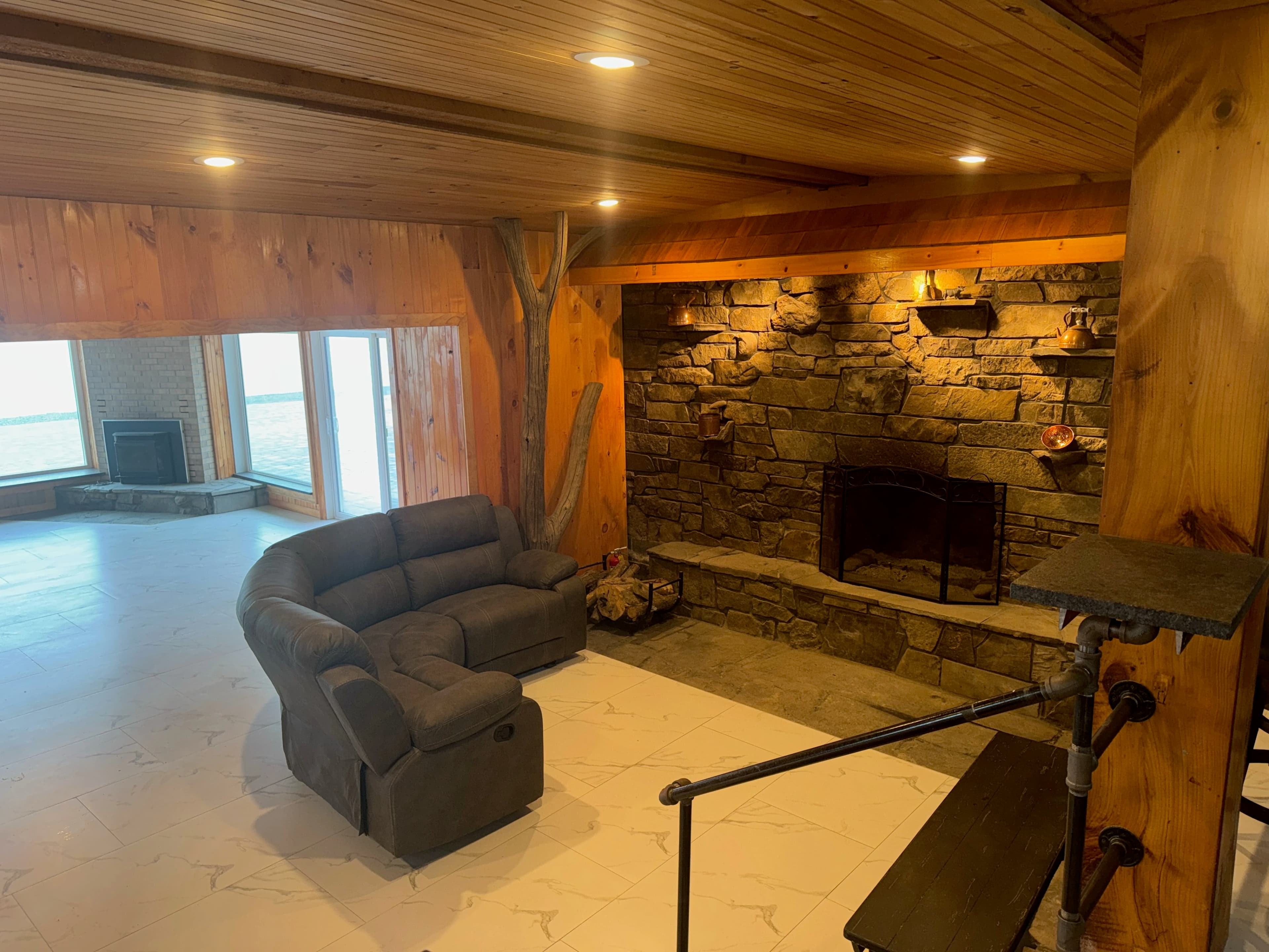 Cozy lounge with stone fireplace
